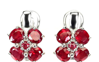 Earrings in rhodium-plated sterling silver with treated rubies
