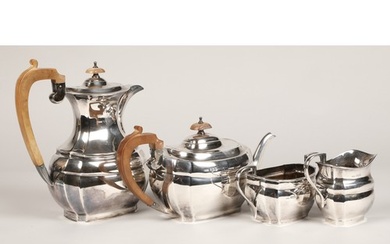 Four piece silver tea service, with hard wood stylised handl...