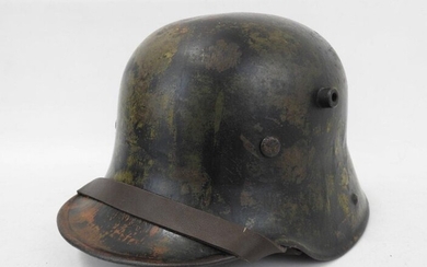 GERMANY. M16 Stahlhelm helmet camouflaged in green and...