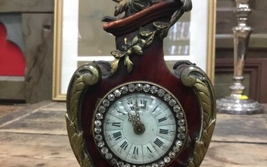 Late 19th century French tortoiseshell shell veneered timepiece with cast gilt brass mounts and paste set bezel. 21cm