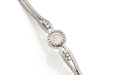 OMEGA TURLER Montre-bracelet de dame en or blanc ciselé, diamants en tout ct. 0.65 circa,...