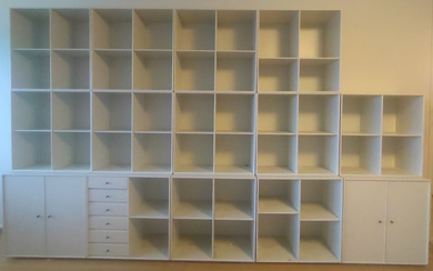PETER J LASSEN. MODULE, CABINETS AND SHELVES, WHITE LACQUERED, MONTANA, DENMARK, 14 PIECES.