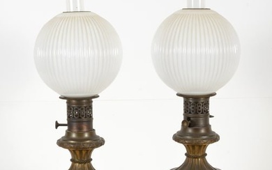 Pair of 19th century Chinese porcelain vases mounted as oil lamps. Crackled white glaze with mask
