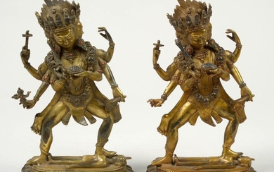 Pair of "Divinities" in gilt bronze and set...
