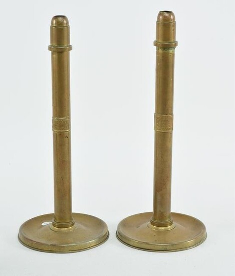 Pair of brass candlesticks, marked Cornelius Baker