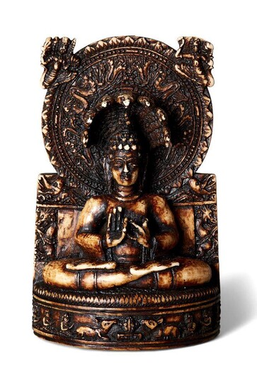 Property of a Gentleman (lots 36-85) An Indian ivory figure of Nagaraja, 19th century, carved seated in dhyanasana beneath a serpent-headed hood, carved to the frieze of the base with kneeling figures and two confronting recumbent deer, 7.5cm high...
