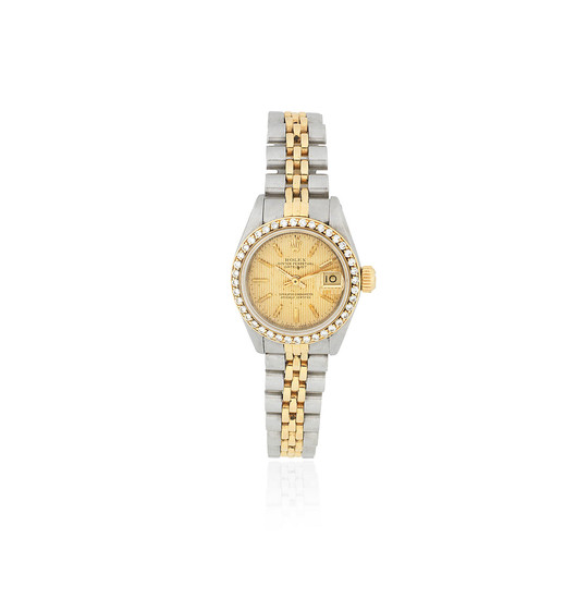 Rolex. A lady's stainless steel and gold diamond set automatic calendar bracelet watch