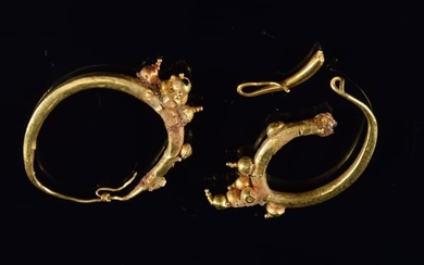 Roman gold earrings, ca. 100 B.C. - 100 A.D. Gold hoop earrings with bead decoration. 1 earring has