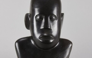 Sylvester Mubayi (Zimbabwean, Born 1942) A carved serpentine rock bust modelled as an African tribesman, signed S Mubayi. Circa 1970. Height 34 cm.