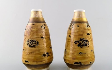 Theodor Larsen for Royal Copenhagen. A pair of porcelain vases decorated in gold and black.
