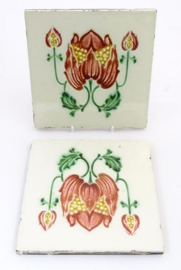 Two tiles decorated with stylised tulip / flower