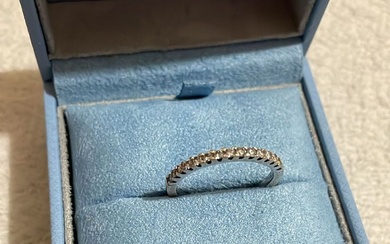 18ct white gold half eternity ring with half a carat...