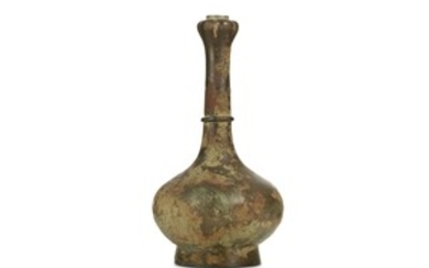 A CHINESE BRONZE VASE. Han Dynasty. Of pear-shaped...