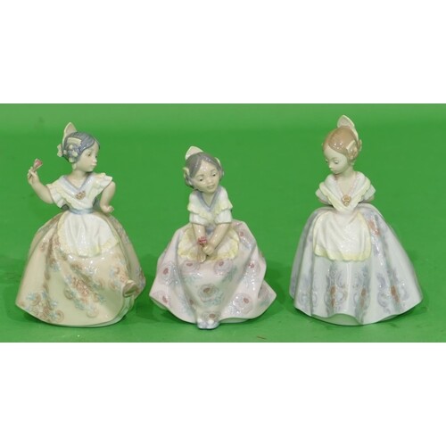 3 x Lladro Small Figurines of ladies holding encrusted flowe...