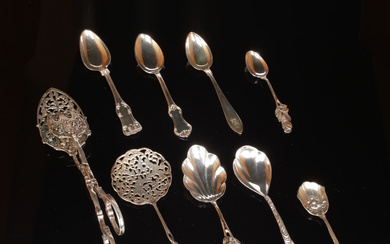 35 silver spoons and baking tongs, 20th century.