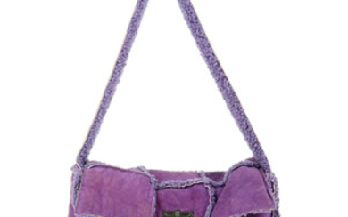 CHANEL - a purple suede Choco Bar handbag. View more details