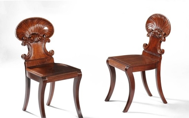 A pair of Regency mahogany ‘shell back’ hall chairs