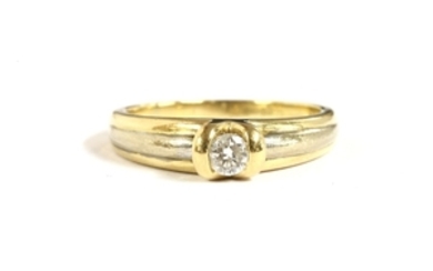 A two colour gold single stone diamond ring