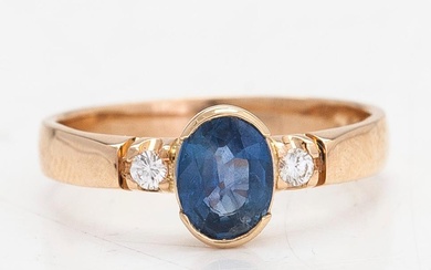 A 14K gold ring, with brilliant cut diamonds approx. 0.06 ct in total and sapphire Kultakeskus, Hämeenlinna 1990.