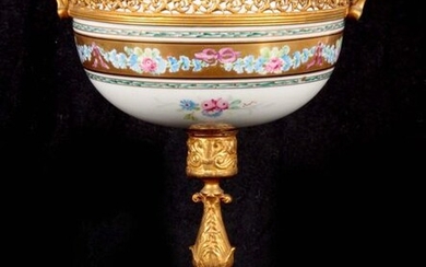 A 19TH CENTURY FRENCH SERVES PORCELAIN ORMOLU MOUNTED CUP with...