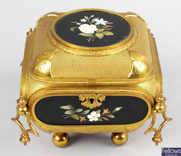 A 19th century gilt metal trinket box and cover of cushion form.