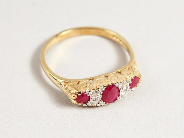 A 9CT GOLD RUBY AND DIAMOND RING.