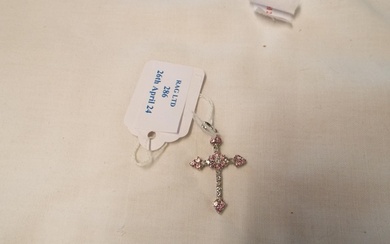 A 9ct white gold cross inset with white and pink stones