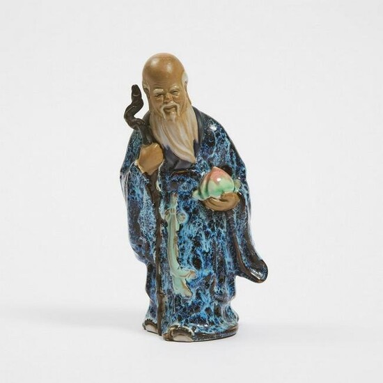 A Chinese Shiwan Flambé Glazed Pottery Figure