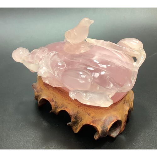 A Chinese carved rose quartz inkwell modelled as peach, with...