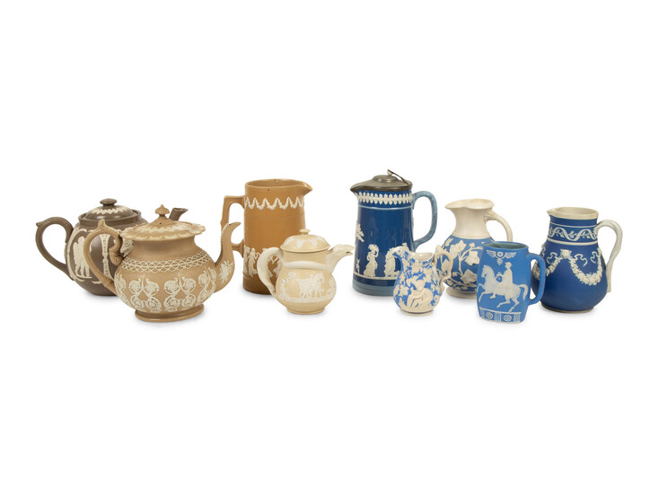 A Collection of Nine English Salt Glazed Relief Form Teapots, Pitchers and Creamers
