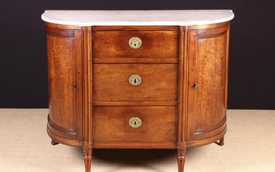 A French Charles X Mahogany Bow Front Cabinet. The Cararra marble top with small break-front demi-lu