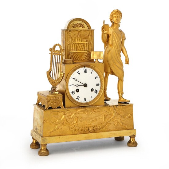 NOT SOLD. A French Empire gilt bronze figural mantel clock with white enamel dial. Early 19th century. H. 39 cm. W. 30 cm. D. 12 cm. – Bruun Rasmussen Auctioneers of Fine Art