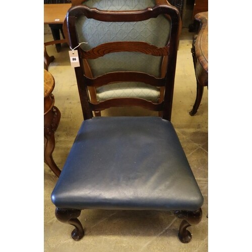 A George II style walnut ladderback dining chairCONDITION: A...