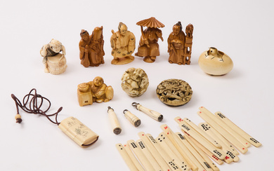 A Group of Ten Ivory, Antler, and Bone Netsuke, Together With Twenty-Four Game Counters and Pieces, 19th-20th Century