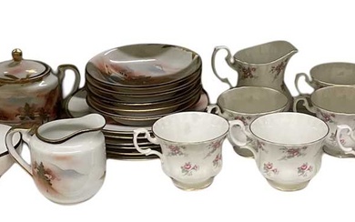 A Japanese part tea service comprising teapot, four teacups, lidded...