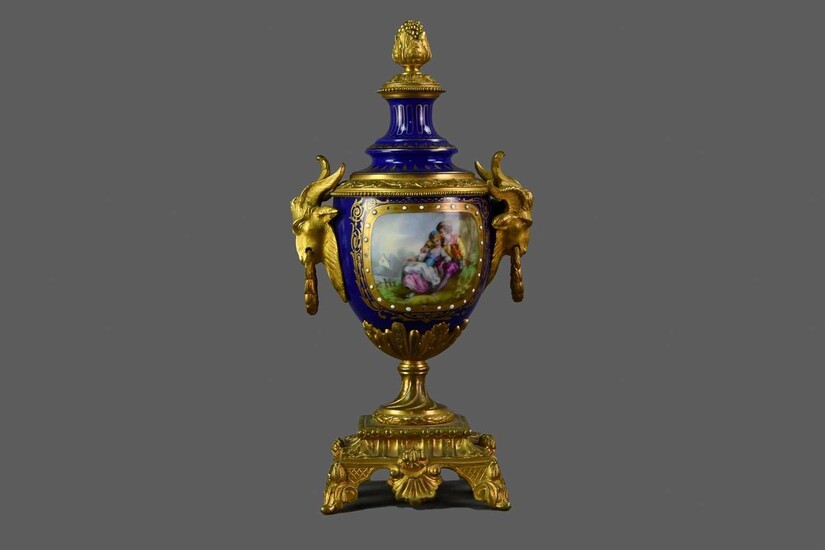A LATE 19TH CENTURY ORMOLU MOUNTED CONTINENTAL PORCELAIN VASE AND COVER