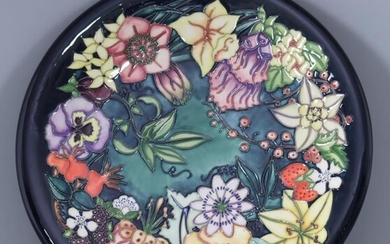 A Limited Edition Moorcroft Pottery Charger, with "Carousel" design...