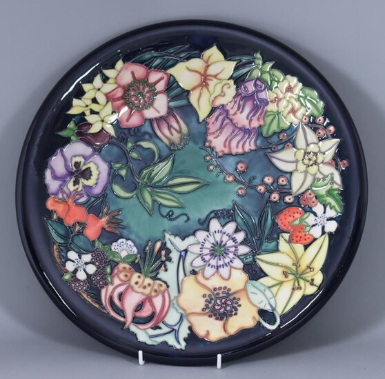 A Limited Edition Moorcroft Pottery Charger, with "Carousel" design...
