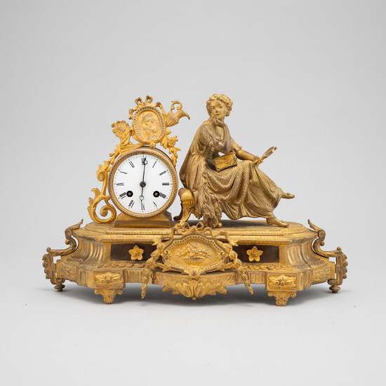 A Louis XVI-style ormolu and parcel gilt mantel clock, mid 19th Century.