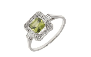 A PERIDOT AND DIAMOND CLUSTER RING. the octagonal-shaped per...