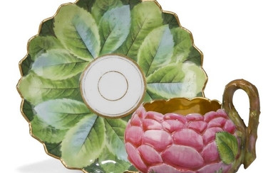 A Paris porcelain (Darte) cup and a saucer, c.1820, gilt Darte Freres a Paris mark to cup, saucer with removed mark and green 61. mark, the cup formed as a pink rose, the stem handle with leaf terminals and issuing from a meandering stem wrapped...