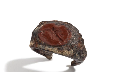 A Roman Iron and Red Jasper Finger Ring with a Gryllos (Composite Figure)