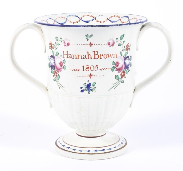 A Staffordshire pearlware named and dated loving cup