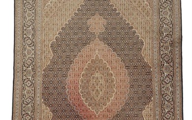 A Tabriz carpet, Persia. Medallion design, outlines with silk pile. 20th/21st century....