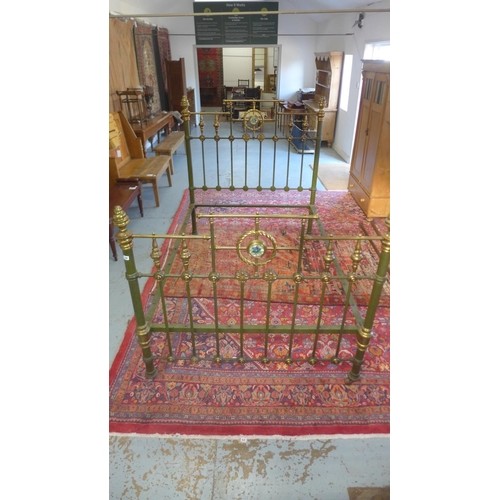 A Victorian brass and iron 4 foot 6 inches bed, with mother ...
