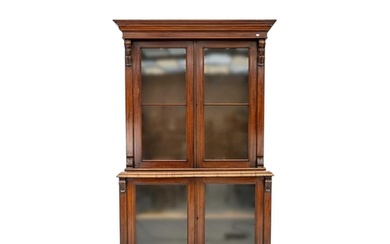 A Victorian mahogany bookcase cabinet. The upper part with t...
