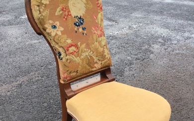 A Victorian mahogany chair with floral woolwork upholstered spoon back...