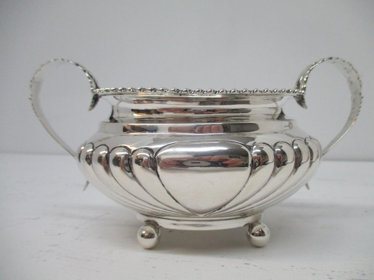 A Victorian silver sugar bowl by John Henry Rawlings, London...
