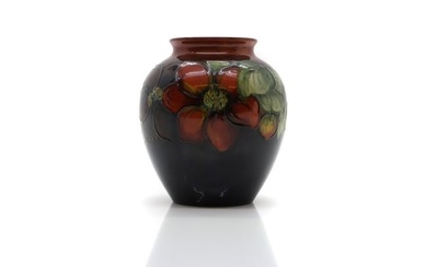 A Walter Moorcroft pottery 'Clematis' pattern vase