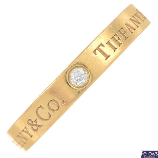 A brilliant-cut diamond band ring, by Tiffany & Co.